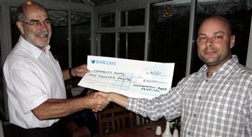 Duncan Reade from Community Roots receives a cheque from donations at Southampton Beer Festival